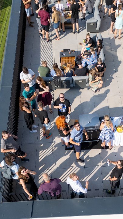 Drone image from above of a terrace party at the Kentico office in Brno.